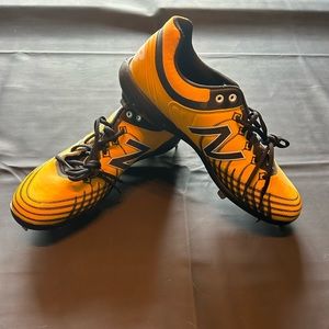 Custom black & yellow new balance cleats